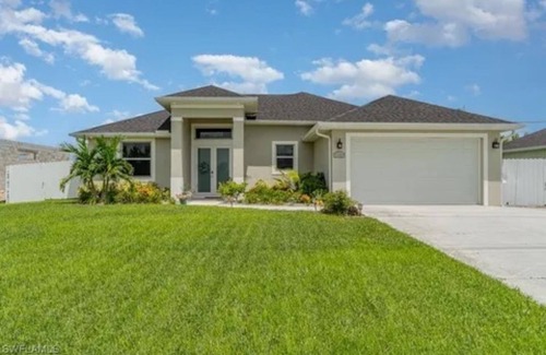 Trafalgar House | Paradise of Cape Coral on Canal, with Heated Pool, Tiki Hut Grill & Elec Bikes