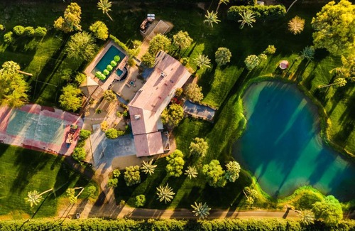 Palm Springs House | Paradiso by AvantStay Pool Lake Fire Pit Billiards Room Elegant Secluded Estate