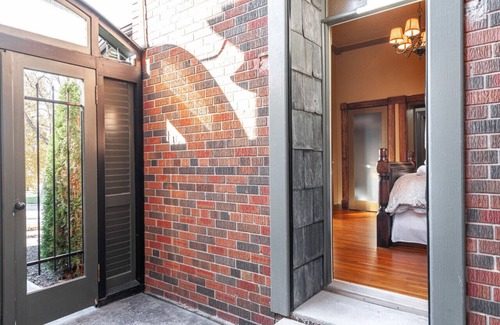 Stratford Apartment | Patio Suite with Sunroom | by Henry House Stays