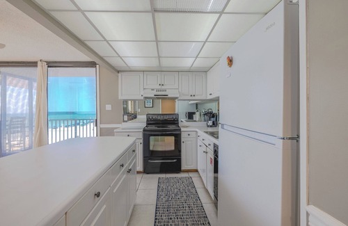 Panama City Beach Condo | PCB Sunset Breeze: beachfront, wrap balcony, bedrooms overlooking Gulf & pool