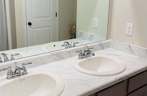 Lovejoy House | Peaceful and cozy master suite with private bathroom and walk in closet