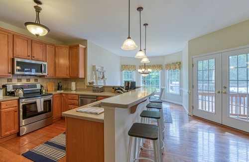 Livingston House | Peaceful lakeside retreat with hot tub, private pool, dock & paddle boards