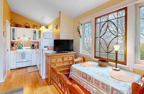 Sylvan Shores Cottage | Peaceful wooded cottage with seasonal lake views, WiFi, private parking, & patio