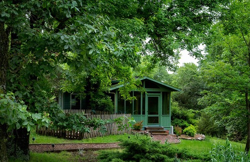 Sylvan Shores Cottage | Peaceful wooded cottage with seasonal lake views, WiFi, private parking, & patio