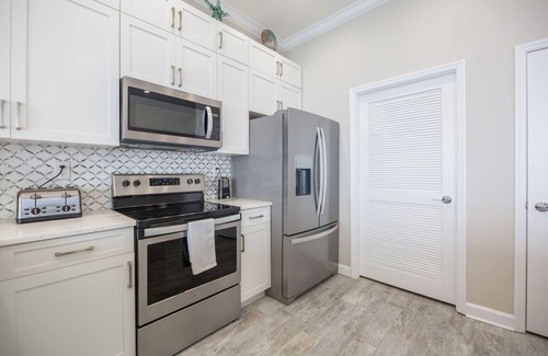 Thomas Drive Condo | Penthouse corner, floor to ceiling windows, high ceilings 2 primary a guestroom