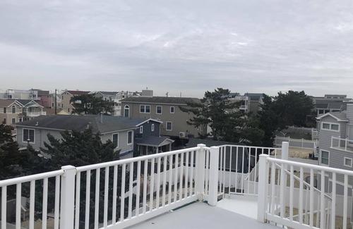 Ship Bottom House | Pet friendly. Ocean Block. Ship Bottom. Beach Badges. Beach equipment. Elevator. Game room. Roof top deck. Private yard. Three lower level bedrooms. Walk to everything Ship Bottom has to offer! Pizza; ice cream; mini-golf; adult libations; etc.