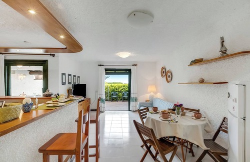 Porto San Paolo Apartment | Piazzetta Villa Pieds Dans L’eau, Porto San Paolo, Italy
