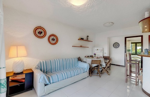 Porto San Paolo Apartment | Piazzetta Villa Pieds Dans L’eau, Porto San Paolo, Italy