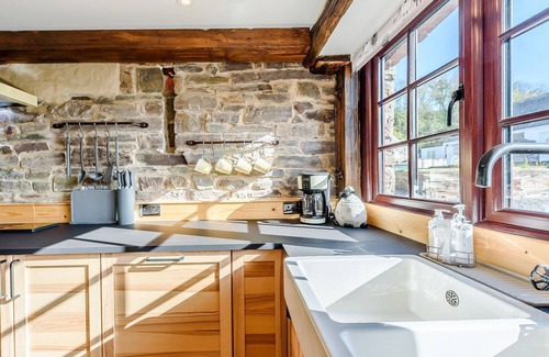Ferryside Cottage | Picked for its luxury finish inside, stunning estuary views and a private hot tub.