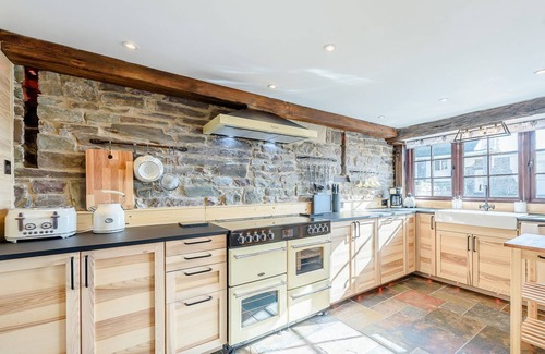 Ferryside Cottage | Picked for its luxury finish inside, stunning estuary views and a private hot tub.
