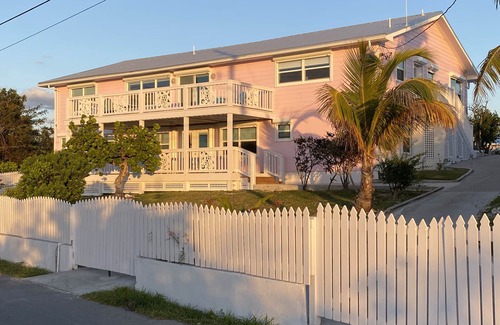 Treasure Cay House | Pink Bikini Island Cottage with a dock on Black Sound