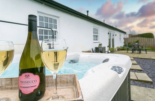 Bryngwran Cottage | Plas Old Dairy - a hot tub that sleeps 4 guests in 2 bedrooms