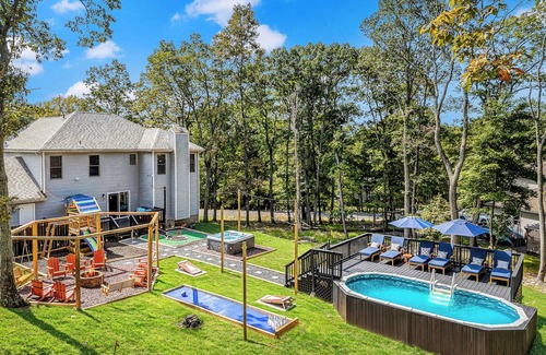 East Stroudsburg House | Pocono Dream House! Heated Pool, Fire Pit, Bowling, Mini Golf!