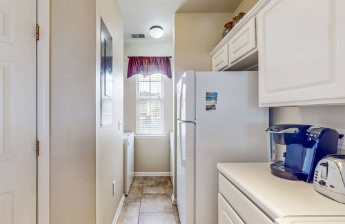 Sunset Beach Condo | Pond-front condo near beach with balcony, pool, & hot tub - snowbird-friendly