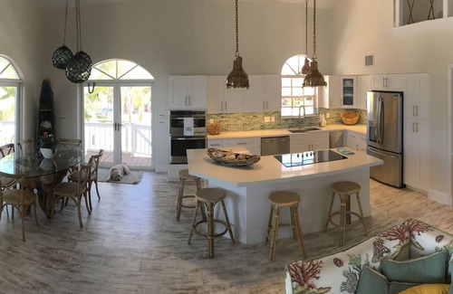 Doctor's Arm House | Pool house with open water and sunset in the Florida Keys