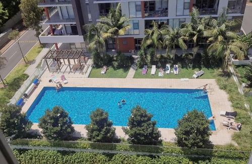Macquarie Park Apartment | Pool View of Marquarie Park Paradise