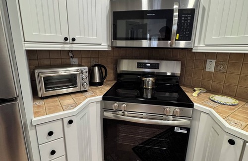 Harbor Village Condo | Poolside 2BR Retreat Canal Dock 6 minutes Walk to the Beach
