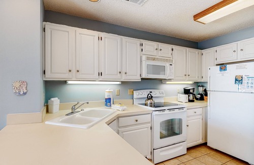 East End House | Poolside dog-friendly townhouse with partial Gulf views, on-site pool & grills