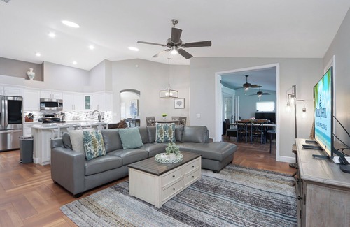 Cypress Lake House | Poolside Paradise is a luxurious modern home in the popular community of Parker Lakes