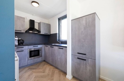 Ewijk House | Prachtige vakantiewoning op park aan zwemwater