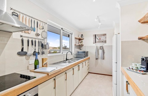 Halls Head Villa | PRIME BEACHFRONT. PRIME VIEWS. PRIME TIME. Elegance, with mobility elevator.