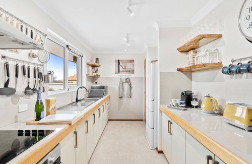 Halls Head Villa | PRIME BEACHFRONT. PRIME VIEWS. PRIME TIME. Elegance, with mobility elevator.