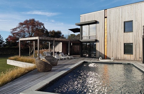North Sea House | Pristine 6-bedroom waterfront property with a private dock in Southampton