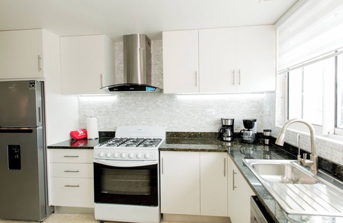 El Cortecito Apartment | Pristine Beach with Crystal-clear water for your getaway. 4BR, Pool, Rooftop.