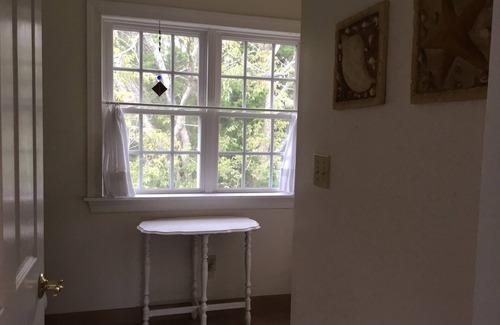 Cape May Point House | Pristine, Cozy, 4 bedroom Beach Cottage with a 40 foot screened in front porch!