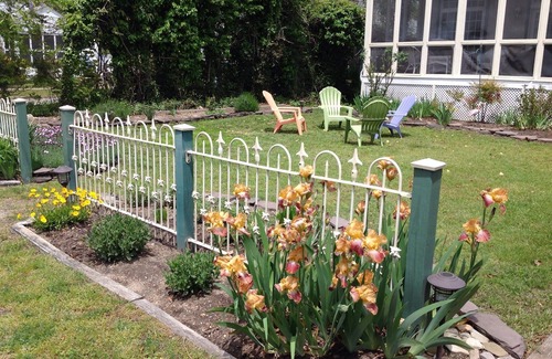 Cape May Point House | Pristine, Cozy, 4 bedroom Beach Cottage with a 40 foot screened in front porch!