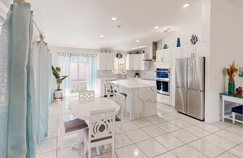 Marathon House | Pristine, updated retreat with private pool, screened deck, dock, & pool table
