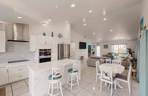 Marathon House | Pristine, updated retreat with private pool, screened deck, dock, & pool table