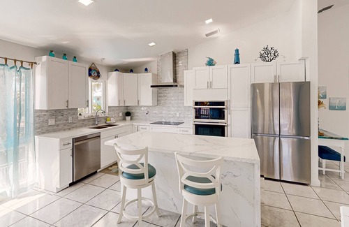 Marathon House | Pristine, updated retreat with private pool, screened deck, dock, & pool table