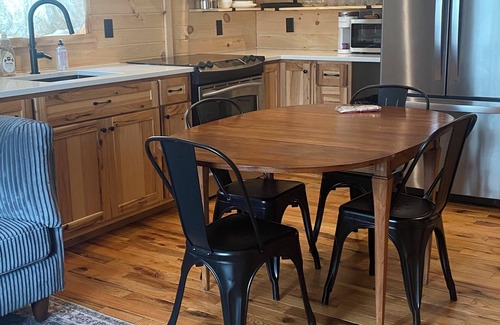 Amery Cabin | Private 3bdr cabin on Apple River kayaks, SUPS, and paddle boat. Pet friendly!