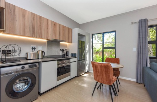 Greater Johannesburg Metropolitan Area Apartment | Private Balcony and Lush Comfort | Elegant Apartment