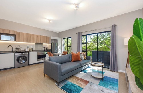Greater Johannesburg Metropolitan Area Apartment | Private Balcony and Lush Comfort | Elegant Apartment