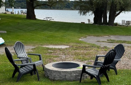 Onekama Apartment | Private beachfront 2BR w deck and firepit in Onekama