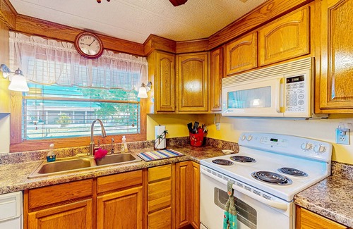 Ellenton House | Private community home with on-site pool, screened patio, central AC, & W/D