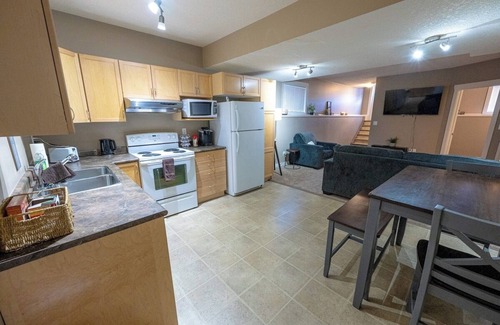 Grande Prairie Apartment | Private Cozy Suite | Full Kitchen | Smart TV | WIFI