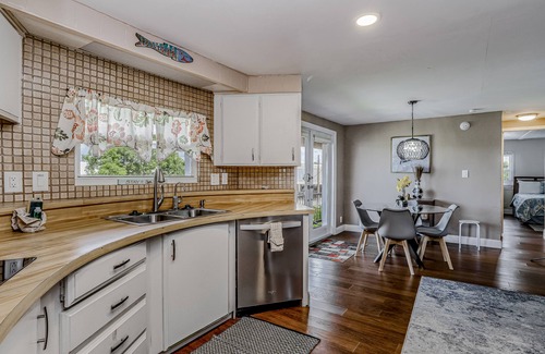 Goodland House | Private Dock, Boats & Bikes Charming Canal-Side Condo w/Screened Porch