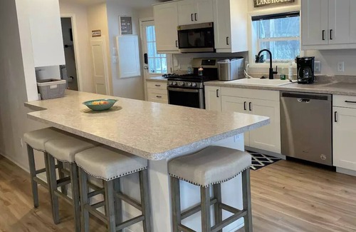 Shawano Cottage | Private Dock, Private Sand Beach and Shawano Lake's Only Boathouse Bar with a TV