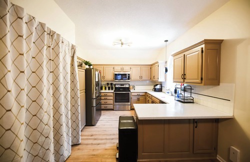 Waldron House | Private Urban Oasis with heated pool spa, outdoor bar and TV, firepit, corn hole