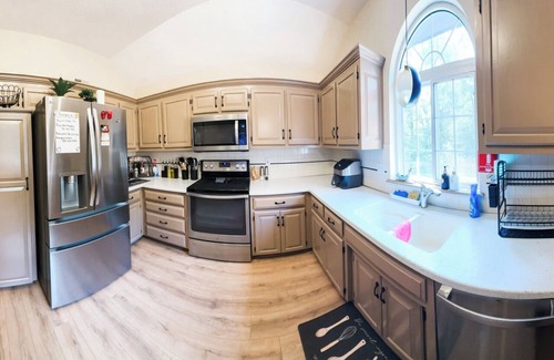 Waldron House | Private Urban Oasis with heated pool spa, outdoor bar and TV, firepit, corn hole