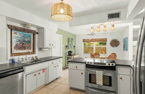 River Isles House | Private wooded 3BR/3BA house w/heated pool on canal just steps from beach