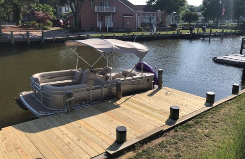 Ocean Pines Cottage | Pura Vida.Canal front beach cottage with private dock and sleeps 8