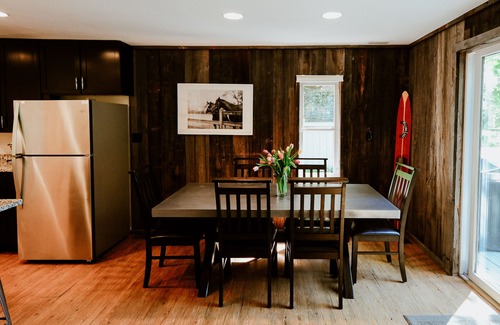 Lake Leelanau Cottage | Quaint cottage ON Lake Leelanau! Dock, deck, fire pit, large lawn!