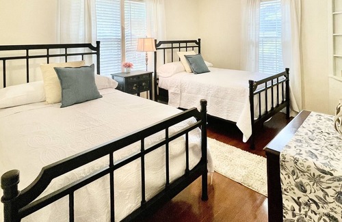 Midtown Cottage | Quaint cottage style home with two sitting areas-2 minutes to shops and eateries