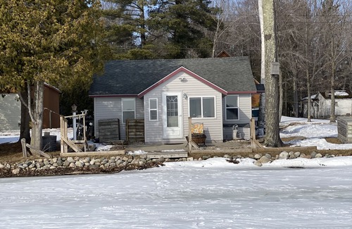 Carp Lake Cottage | Quaint Cottage with a Private Dock on Paradise Lake