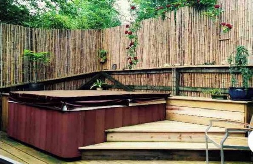 Asheville House | Quiet bungalow in west Asheville with hot tub, fitness room, and a wood stove.
