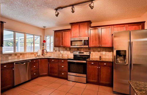 Palm Coast House | Quiet home with enclosed yard, heated pool with jets, & screened lanai
